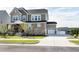 Charming two-story home boasts stone accents, a welcoming front porch and large driveway at 213 North Crest Dr, Chapel Hill, NC 27517