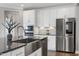 Close up of bright kitchen with modern stainless appliances and sleek countertops at 213 North Crest Dr, Chapel Hill, NC 27517