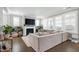 Bright living room with a cozy fireplace, plush sofa, and large windows offering plenty of natural light at 213 North Crest Dr, Chapel Hill, NC 27517