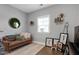 Comfortable upstairs loft area with cozy seating area and natural light from the window at 213 North Crest Dr, Chapel Hill, NC 27517