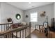 Upstairs loft area with cozy seating area and natural light from the window at 213 North Crest Dr, Chapel Hill, NC 27517