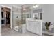 This luxurious main bathroom has a glass shower and walk-in closet for easy access at 213 North Crest Dr, Chapel Hill, NC 27517