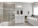 Beautiful main bathroom with a glass shower, soaking tub, and dual sink vanities at 213 North Crest Dr, Chapel Hill, NC 27517