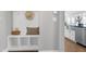 Inviting mudroom with built-in storage cubbies, bench and coat hooks, leading to a modern kitchen at 213 North Crest Dr, Chapel Hill, NC 27517