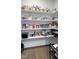 Walk-in pantry features extensive shelving, offering ample storage for food and kitchen essentials at 213 North Crest Dr, Chapel Hill, NC 27517