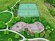Overhead view featuring two tennis courts with green surface and a nearby playground with slides and swings at 213 North Crest Dr, Chapel Hill, NC 27517
