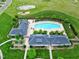 An aerial shot of the neighborhood pool with deck furniture, manicured landscaping, and a community clubhouse at 213 North Crest Dr, Chapel Hill, NC 27517