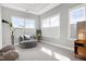 This airy sitting room features oversized windows that provide plenty of natural light at 213 North Crest Dr, Chapel Hill, NC 27517