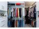 Custom walk-in closet with plenty of shelving, hanging rods, and drawers for optimal organization at 213 North Crest Dr, Chapel Hill, NC 27517