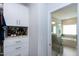 Custom walk-in closet with a built-in vanity and easy access to the main bathroom at 213 North Crest Dr, Chapel Hill, NC 27517