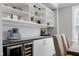 Refined wet bar area featuring a built-in wine cooler and shelving, ideal for entertaining guests at home at 213 North Crest Dr, Chapel Hill, NC 27517