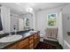 Bathroom features double sinks, shower, tub and large mirror providing convenience and functionality at 215 Haywood St, Raleigh, NC 27601