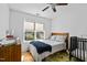 Bright bedroom features a window and cozy bed, and colorful rug creating a peaceful retreat at 215 Haywood St, Raleigh, NC 27601