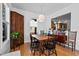 Dining room featuring wood floors, a large dining table, and plenty of natural light at 215 Haywood St, Raleigh, NC 27601