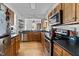 Chef's kitchen featuring stainless steel appliances, wood cabinets, and hardwood floors great for entertaining guests at 215 Haywood St, Raleigh, NC 27601