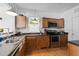 Well-equipped kitchen features wooden cabinets, stainless steel appliances and laminate countertops, perfect for culinary adventures at 215 Haywood St, Raleigh, NC 27601