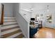 Inviting living room featuring a cozy seating area, hardwood floors, and plenty of natural light from the windows at 215 Haywood St, Raleigh, NC 27601