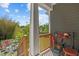 Covered porch features wooden railing, view to backyard, and durable siding at 215 Haywood St, Raleigh, NC 27601