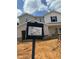 Close-up of home under construction showing building permit and elevation style at 2215 Cherry Creek Rd, Haw River, NC 27258