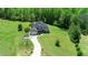 Beautiful property with lush green lawn and surrounded by mature trees at 226 Marshview Cir, Angier, NC 27501