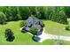Beautiful home with brick and siding exterior surrounded by lush greenery at 226 Marshview Cir, Angier, NC 27501