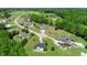 Sprawling neighborhood featuring a variety of homes amidst lush greenery and manicured lawns at 226 Marshview Cir, Angier, NC 27501
