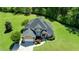 Stunning aerial view of brick home with lush lawn, attached garage, and beautiful landscaping at 226 Marshview Cir, Angier, NC 27501