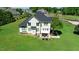 Home with a backyard patio area and well-maintained lawn in a residential area at 226 Marshview Cir, Angier, NC 27501