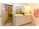 Well-lit bathroom with a double vanity, a separate shower, and a soaking tub at 226 Marshview Cir, Angier, NC 27501