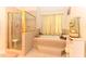 Relaxing bathroom featuring a walk-in shower and a luxurious soaking tub at 226 Marshview Cir, Angier, NC 27501