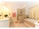 Spacious bathroom with a separate shower, soaking tub, and a dual sink vanity at 226 Marshview Cir, Angier, NC 27501