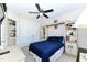 Comfortable bedroom features a ceiling fan and a built-in bookcase headboard with storage at 226 Marshview Cir, Angier, NC 27501