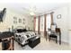 Comfortable bedroom with ceiling fan, large windows, and charming decor at 226 Marshview Cir, Angier, NC 27501