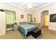 Cozy bedroom with a tray ceiling, ceiling fan, neutral decor, and carpet flooring at 226 Marshview Cir, Angier, NC 27501