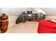 Bonus room with extensive shelving, television, and a comfortable beanbag chair at 226 Marshview Cir, Angier, NC 27501