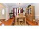 Elegant dining room with wood floors, and classic furnishings creating a perfect space for gatherings at 226 Marshview Cir, Angier, NC 27501