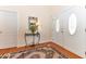 Inviting foyer featuring hardwood floors, a mirror, and a decorative rug, creating a warm welcome at 226 Marshview Cir, Angier, NC 27501