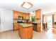 Functional kitchen with wooden cabinets, stainless steel appliances, and a convenient center island at 226 Marshview Cir, Angier, NC 27501