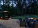 Landscaped backyard patio area featuring both dining and lounge seating, ready for outdoor entertaining at 2317 Emerald Woods Dr, Wake Forest, NC 27587