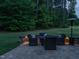Inviting outdoor patio area with cozy seating and gentle lighting for relaxing evenings at 2317 Emerald Woods Dr, Wake Forest, NC 27587