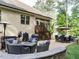 Charming backyard patio featuring a built-in fire pit, perfect for outdoor entertainment at 2317 Emerald Woods Dr, Wake Forest, NC 27587