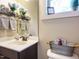 Charming powder room featuring a decorative mirror and stylish fixtures at 2317 Emerald Woods Dr, Wake Forest, NC 27587