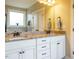 Elegant bathroom with double sinks, granite countertops, and white cabinets with black hardware at 2317 Emerald Woods Dr, Wake Forest, NC 27587