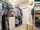 Well-organized walk-in closet with built-in shelving and ample storage space at 2317 Emerald Woods Dr, Wake Forest, NC 27587