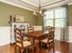 Elegant dining room with hardwood floors, stylish chandelier, and classic decor at 2317 Emerald Woods Dr, Wake Forest, NC 27587