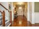 Elegant foyer with hardwood floors, staircase, and stylish decor at 2317 Emerald Woods Dr, Wake Forest, NC 27587