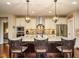 Gourmet kitchen featuring a large island, stainless steel appliances, and custom cabinetry at 2317 Emerald Woods Dr, Wake Forest, NC 27587