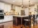 Well-appointed kitchen with stainless steel appliances, granite countertops and a large central island at 2317 Emerald Woods Dr, Wake Forest, NC 27587