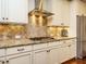 Kitchen features stainless steel appliances, ample storage, and granite countertops at 2317 Emerald Woods Dr, Wake Forest, NC 27587