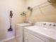 Convenient laundry room with washer, dryer, and storage shelves at 2317 Emerald Woods Dr, Wake Forest, NC 27587